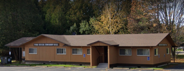 Ford River Township Hall, brown building with parking.